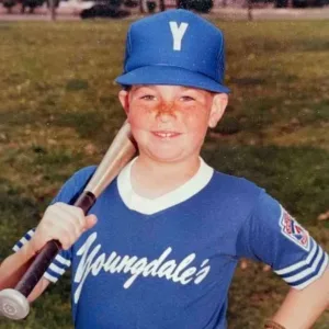 Childhood photo of Jackupuncture founder in a baseball uniform, highlighting early dedication and discipline, captured with Jack-Snap.