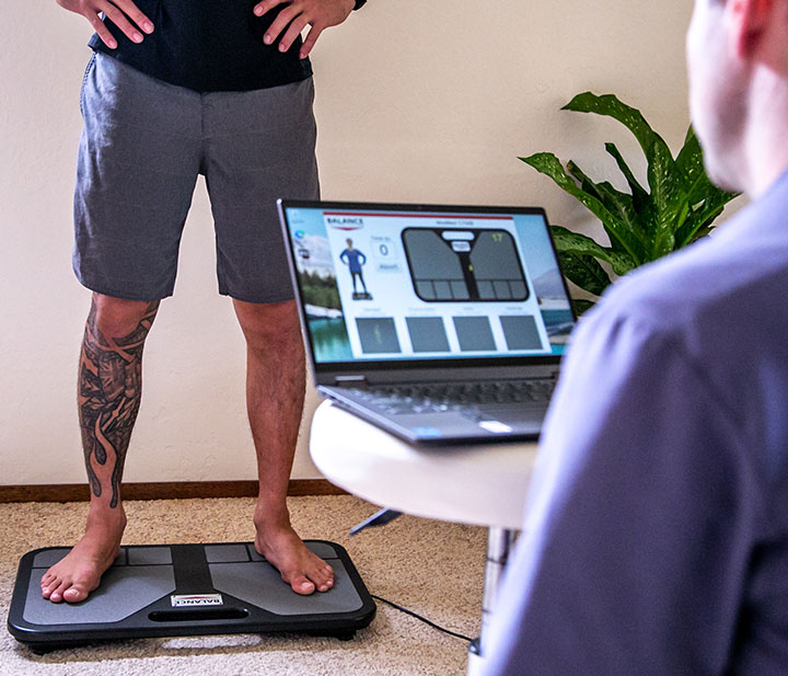 Jackupuncture member undergoing weight and balance assessment with advanced tracking technology, captured with Membership-Weight-Snap.