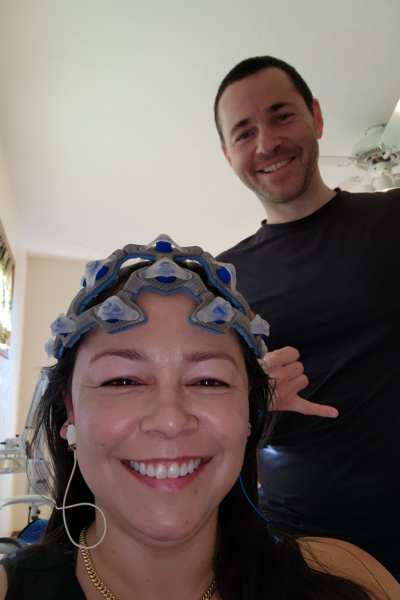 Jackupuncture practitioner conducting a neuromodulation session, enhancing client wellness with cutting-edge brainwave technology.