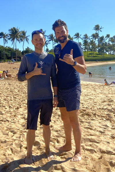 Jackupuncture practitioner enjoying a sunny day at the beach with a client, promoting health and wellness in a tropical paradise.