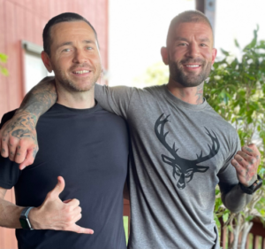 Jack with Muay Thai fighter Marc, highlighting strength, wellness, and recovery through holistic care.